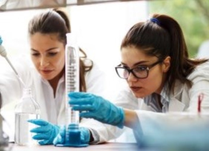 Two students in the lab doing experiments