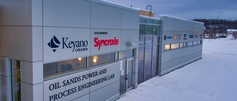 exterior of power lab at KEyano at night with snow