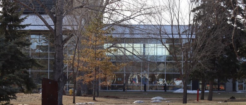 exterior of keyano in afternoon during spring. Doug Macrae park looking through trees