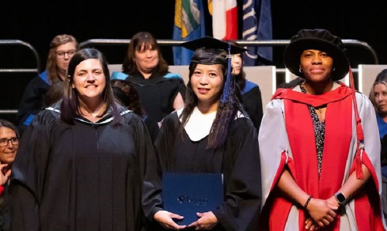 President Sandra Efu, Susie Bowles and a graduate all in robes at Convocation