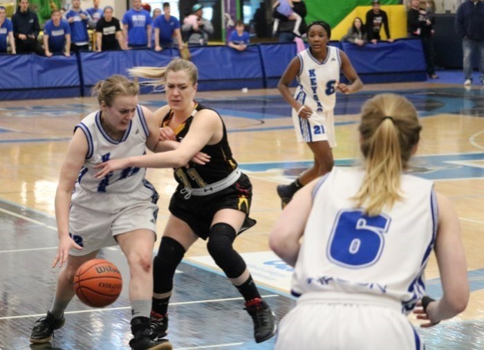 female basketball players on court during game