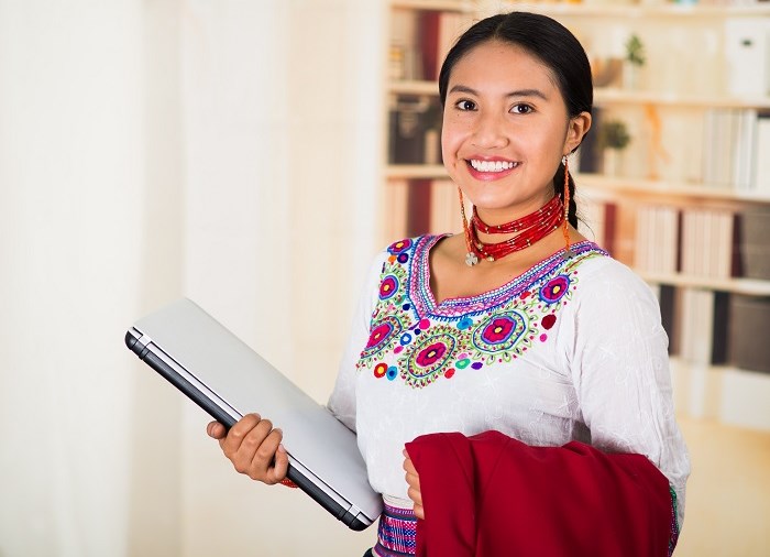 woman standing holding folder