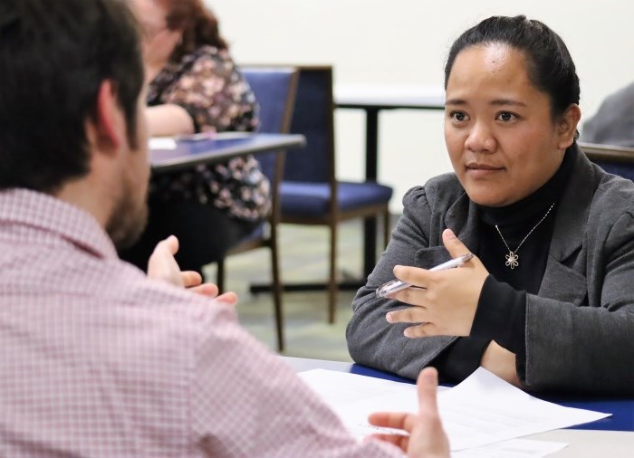 students taking part in mock business interview 