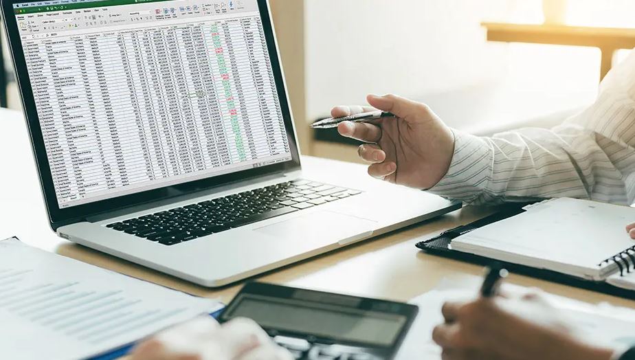 laptop computer screen with microsoft excel 