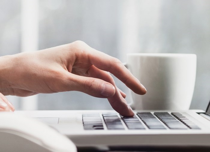 hand on computer typing