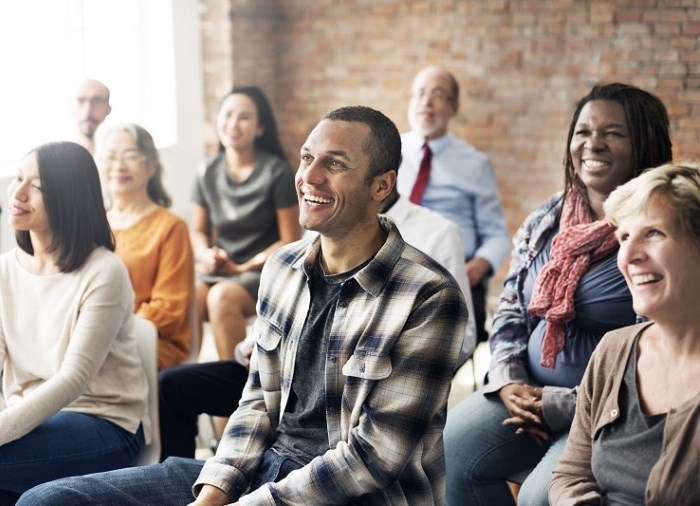 students in classroom smiling