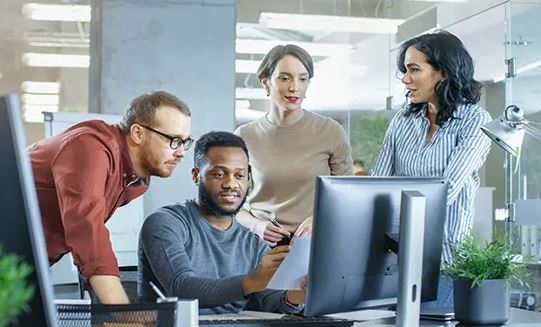staff around computer planning