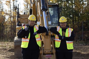 students with heavy equipment