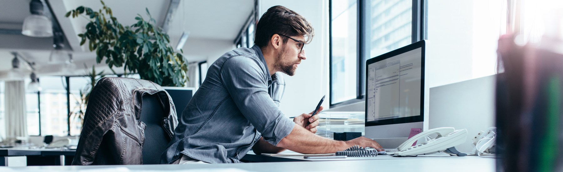 man typing on computer