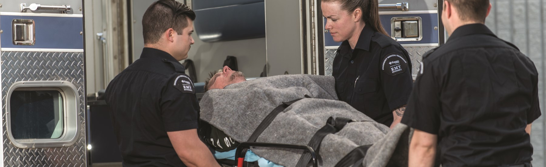 paramedics carry a patient