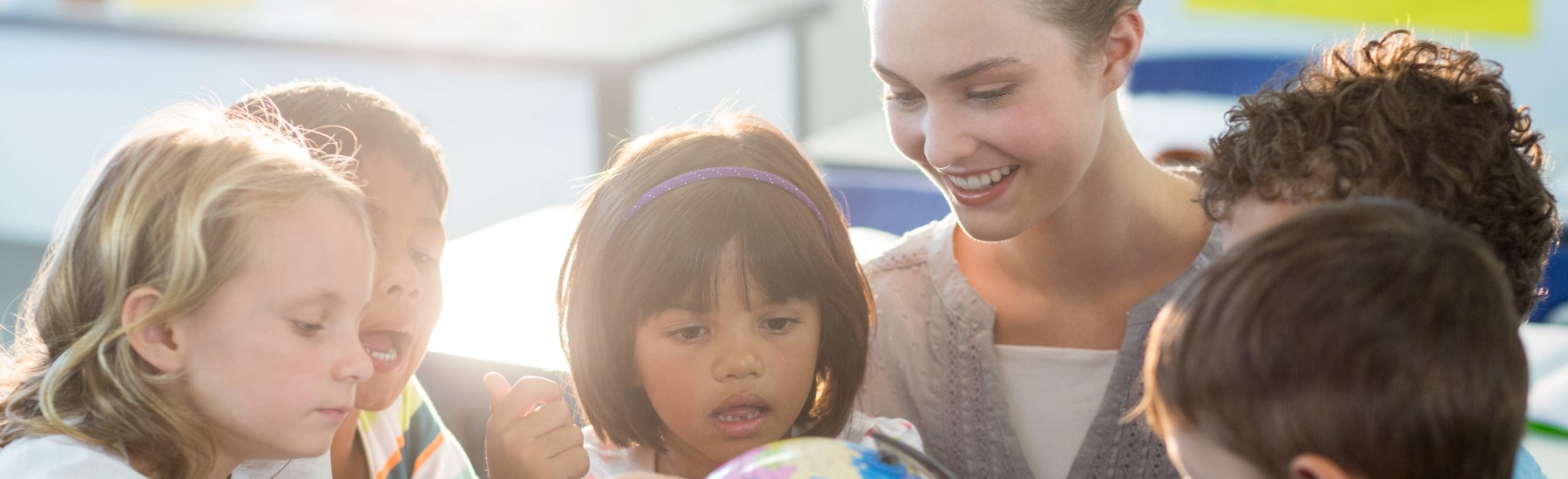 teacher helping students