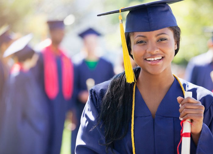 woman holding diploma 