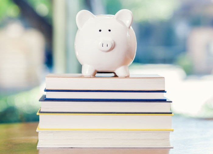 piggie bank on books