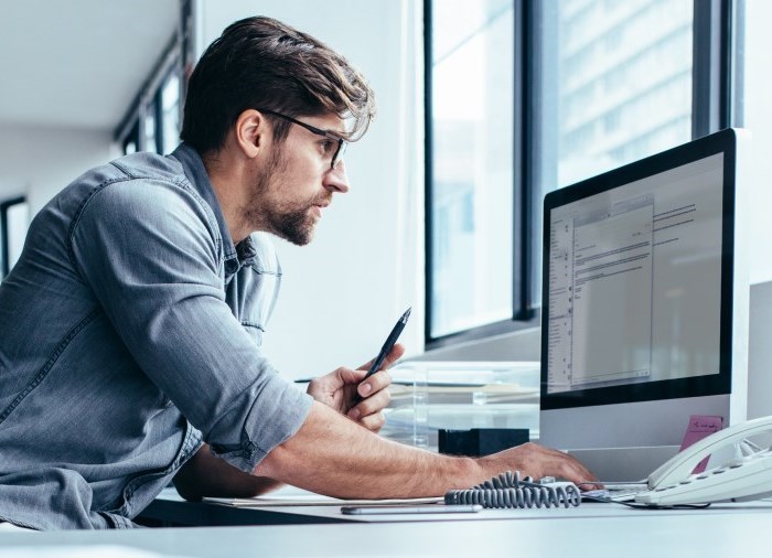 Man typing on computer