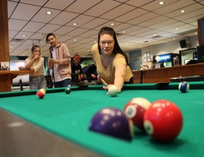 Student playing pool