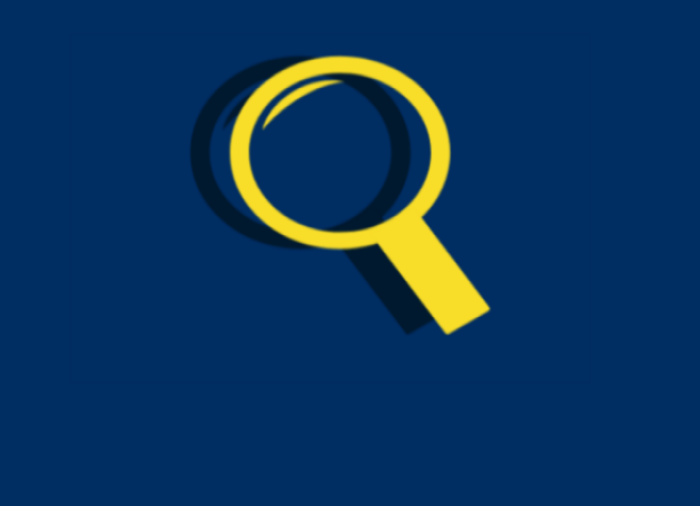 Yellow magnifying glass on dark blue background