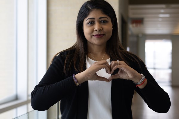 Emily Heralal making hands in heart shape 