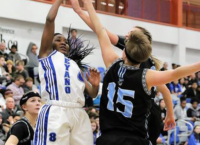 athletes on a basketball court playing