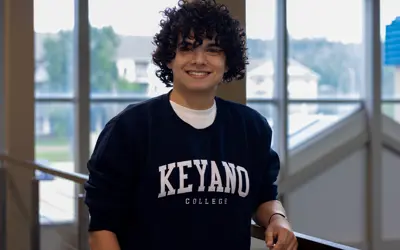 A headshot of Xavier Borges wearing a Keyano College sweatshirt