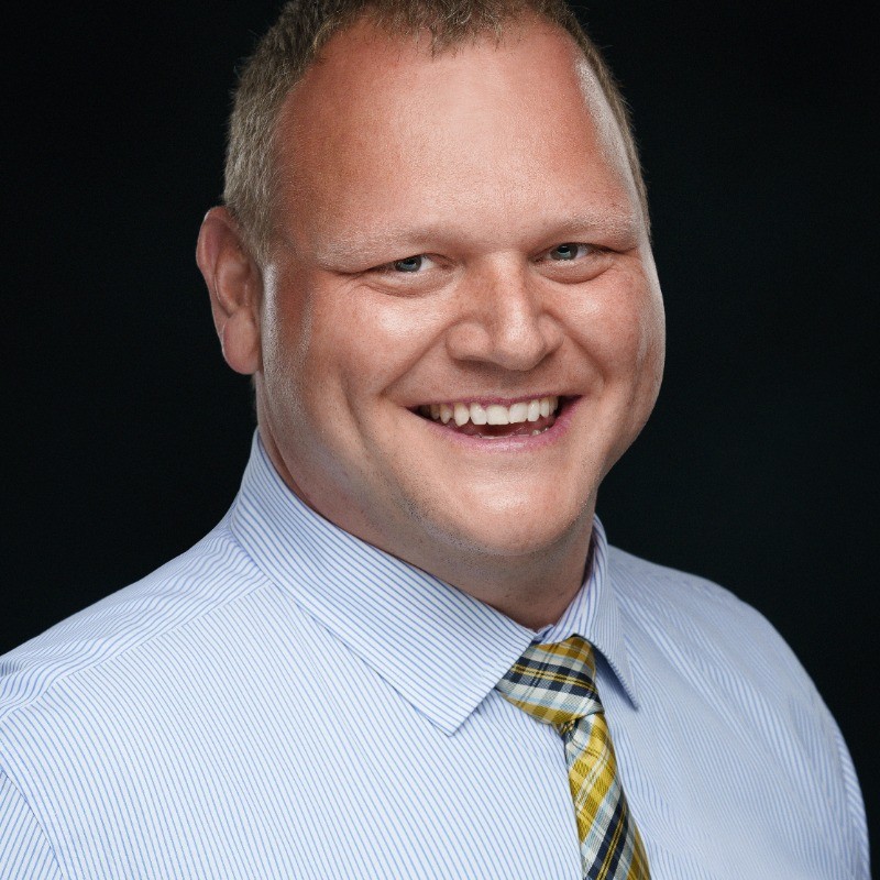 A headshot of Dr. Mark Dolmont
