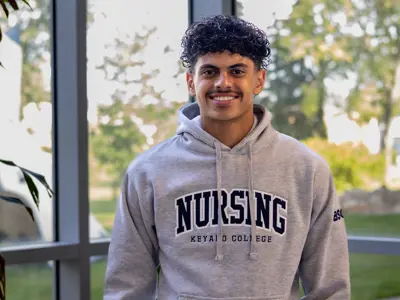 A headshot of Omar Khaleel wearing a Nursing hoodie