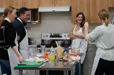 Employees doing team building in the kitchen