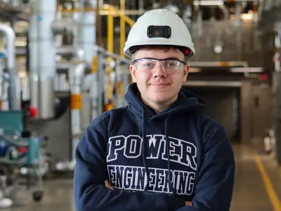 A headshot of Jayden Warr, wearing a Power Engineering hoodie
