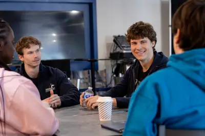 Four students talking to each other